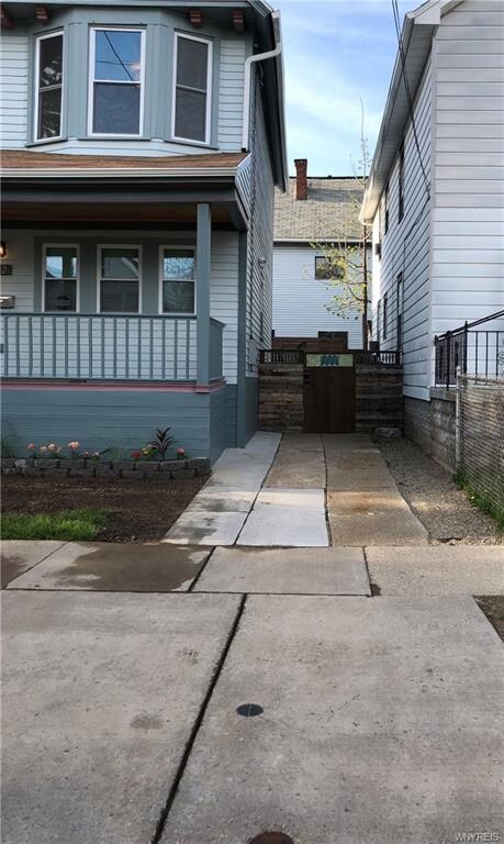 Off Street Parking with Secured Gate Leading to Ba