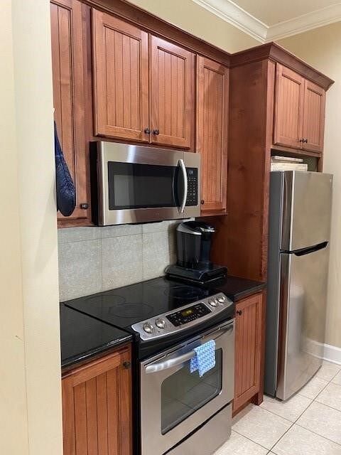 This kitchen features warm wood cabinetry with a s