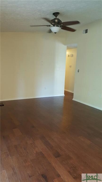 Family Room with vaulted ceiling and hardwood floo