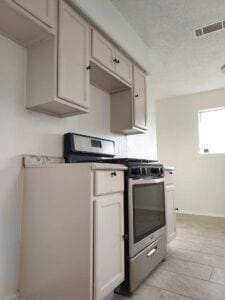 Kitchen featuring stainless steel gas range oven a