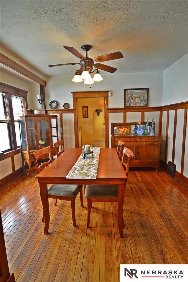Tons of Natural Light with Original Woodwork and Oak Floors. Freshly Painted in Agreeable Grey. Gorgeous Hunter Douglas Ceiling Fan.