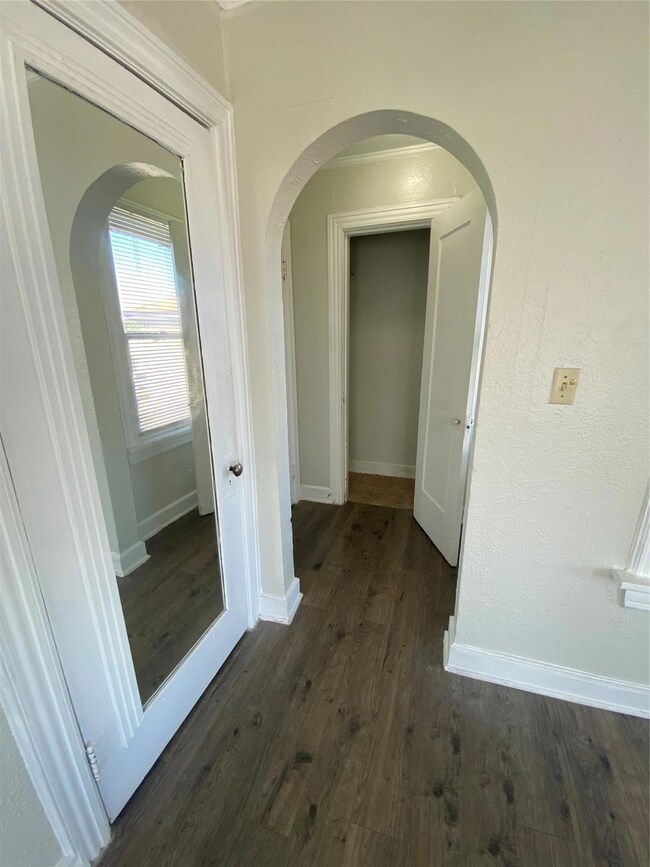 Corridor featuring dark hardwood / wood-style flooring