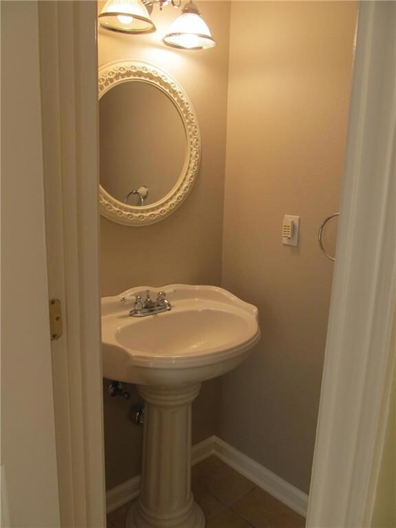Guest half bathroom downstairs off the den