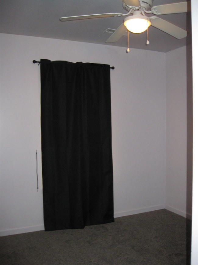 One of the secondary bedrooms with nice sized closet and newer carpet.