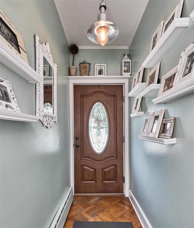 Entry foyer/mud room with wood flooring.