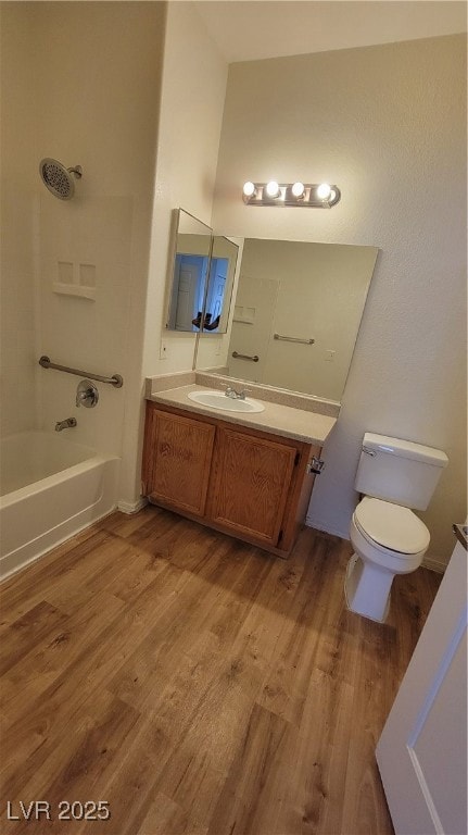 Full bath featuring vanity, wood finished floors,