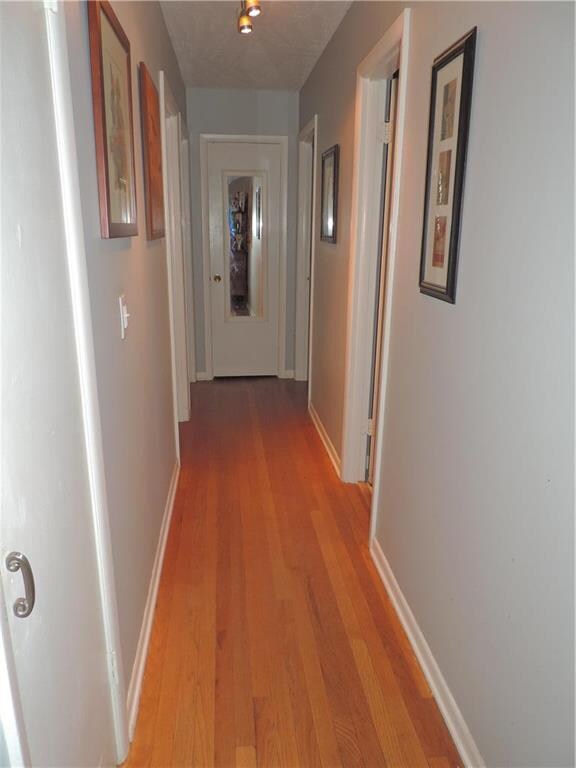 Hallway: Coat closet, linen closet, 3 bedrooms and