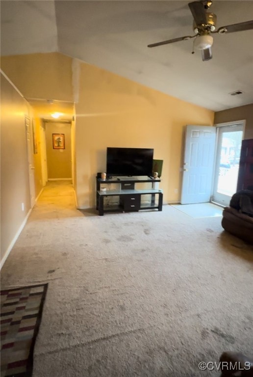 Living room featuring ceiling fan, light colored c