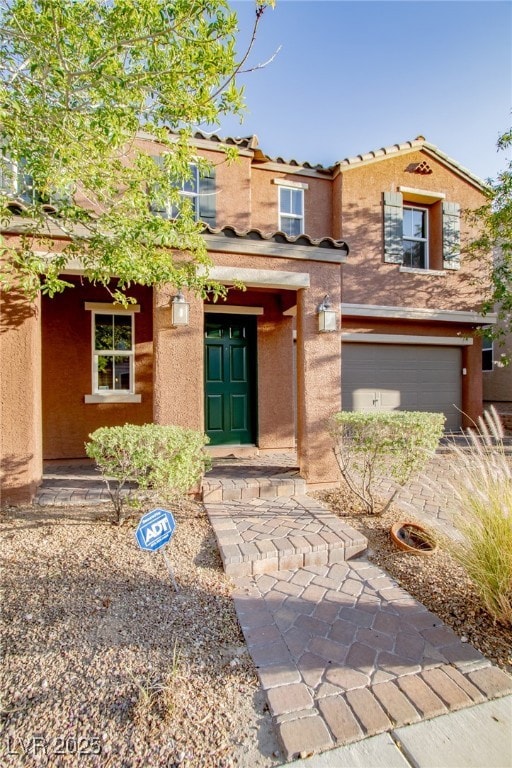 View of front of property featuring stucco siding,