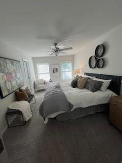 Bedroom with a ceiling fan and carpet