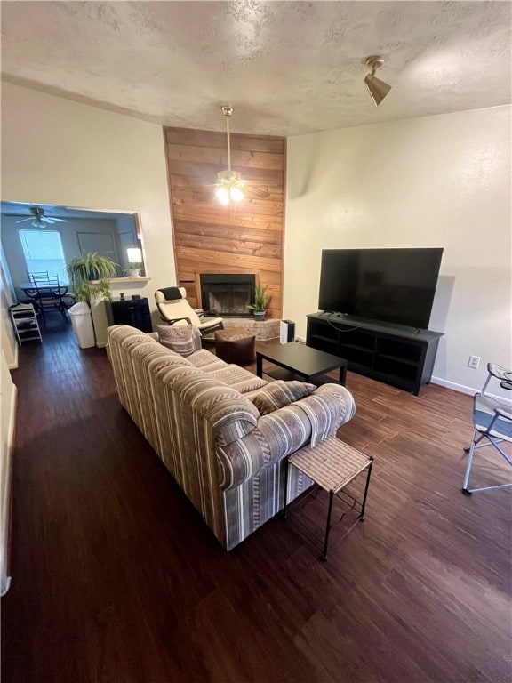 Living area with wood finished floors, a ceiling f