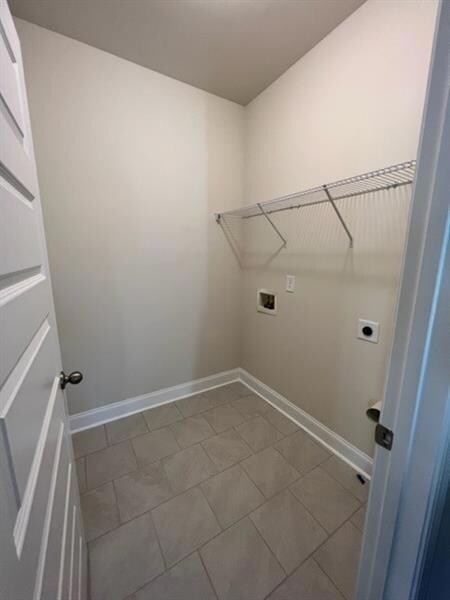 Clothes washing area featuring hookup for a washin