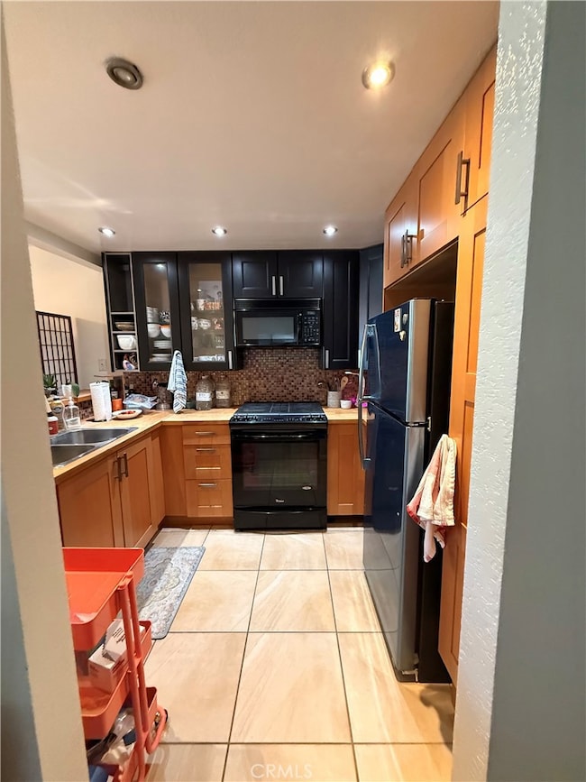 Newer cabinetry, elegant tiled flooring