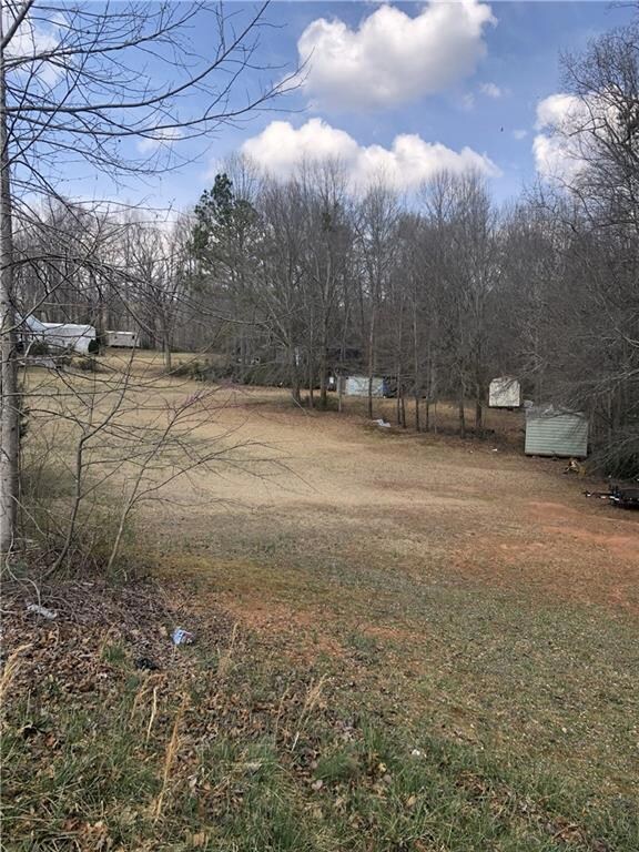 View of yard featuring an outbuilding and a storag