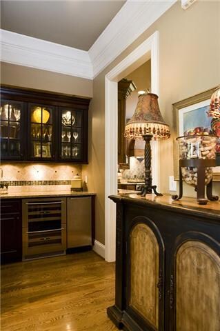 The dining area also features a butlers station with a wet bar, ice machine and a dual draw wine cooler.