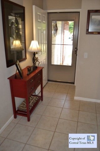Front entry with glass storm door.