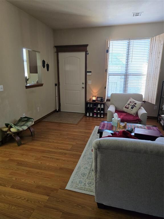Living room featuring hardwood / wood-style floors