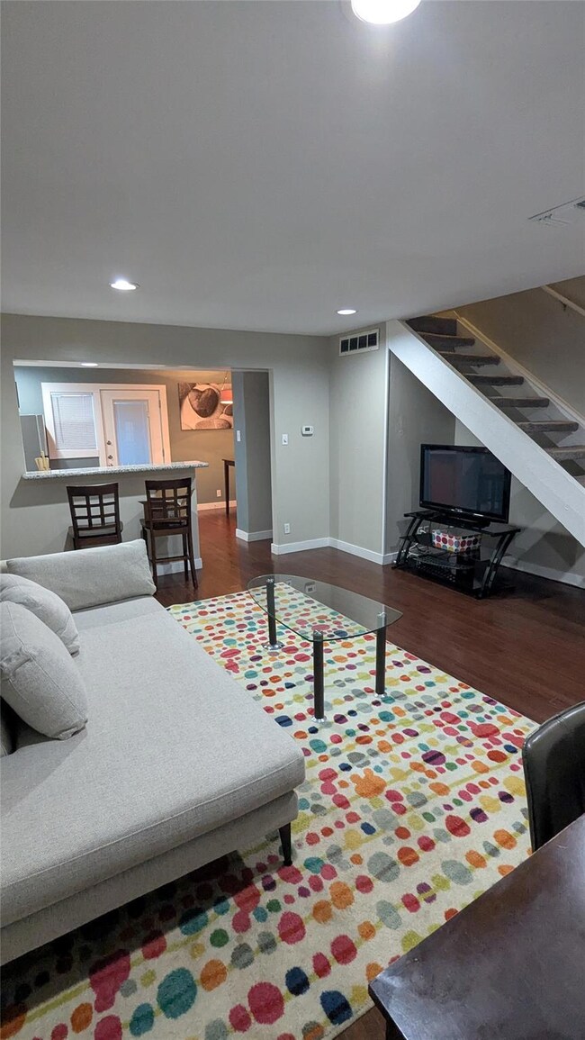 Living area with recessed lighting, wood finished