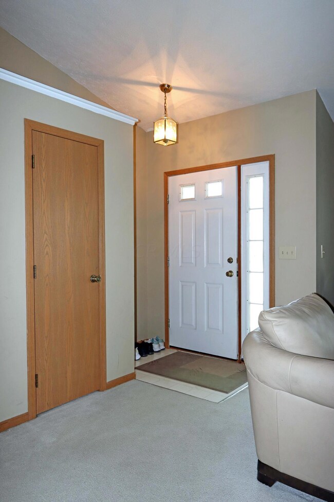Foyer area with guest closet