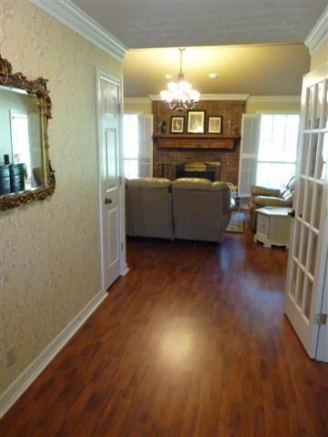 Foyer leads into Open Great Room.  Home features Laminate Wood Floors throughout.