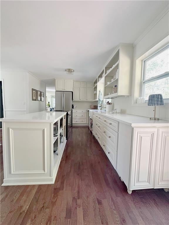 Kitchen with a kitchen island, freestanding refrig