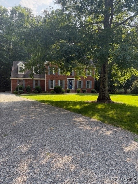View of front facade featuring brick siding and a