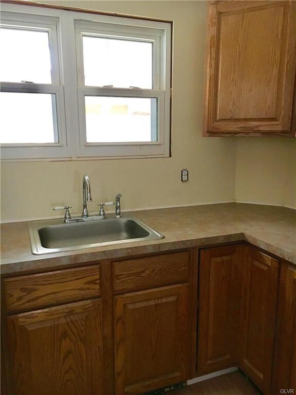 new cabinets, sink, countertops and floor