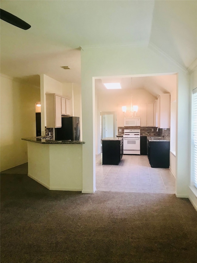 Open floor plan with breakfast bar