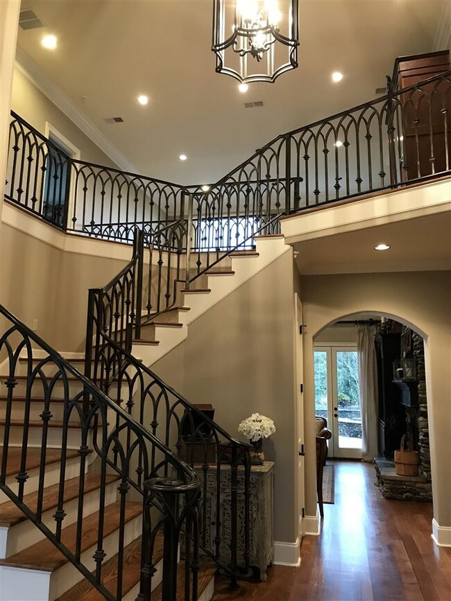 Grand entry staircase.  Home features a front and 