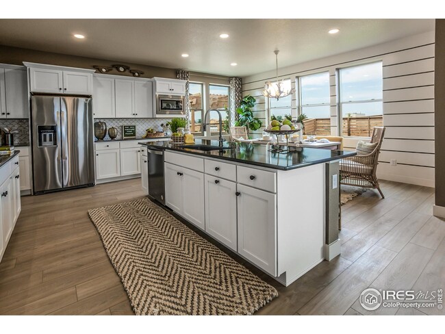 EXAMPLE PHOTO: KTICHEN W/ ISLAND AND OPEN TO DINING ROOM