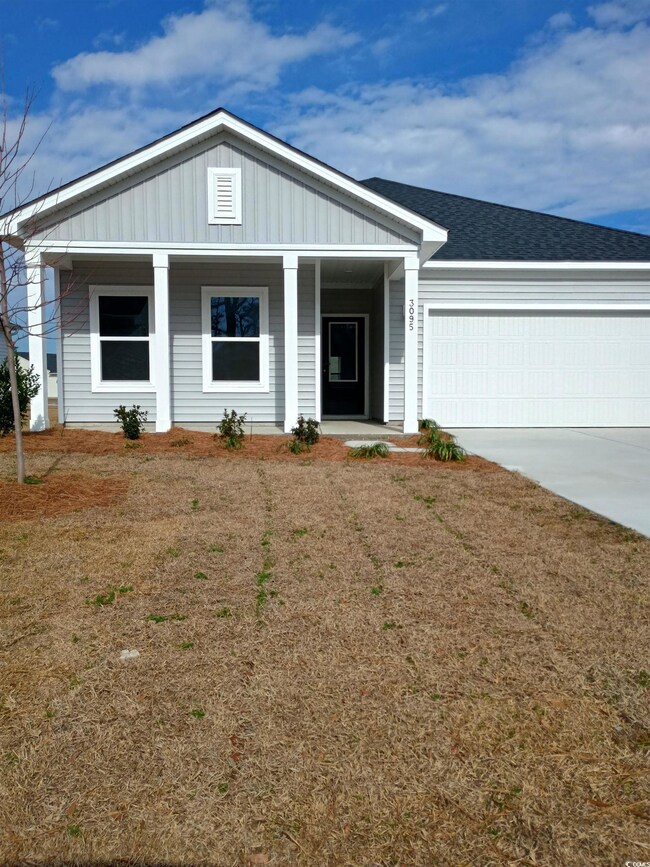 Single story home featuring a porch, a garage, a s