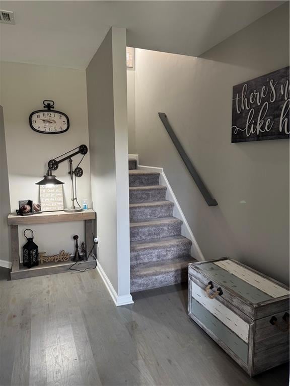 Hall with wood finished floors and baseboards