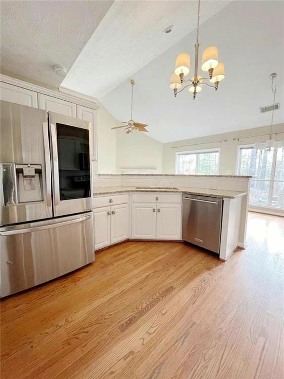 Kitchen featuring a healthy amount of sunlight, wh