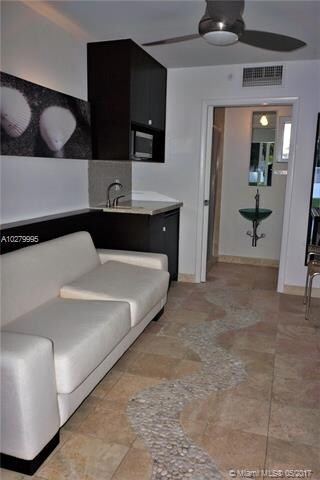 Sofa, microwave, refrigerator