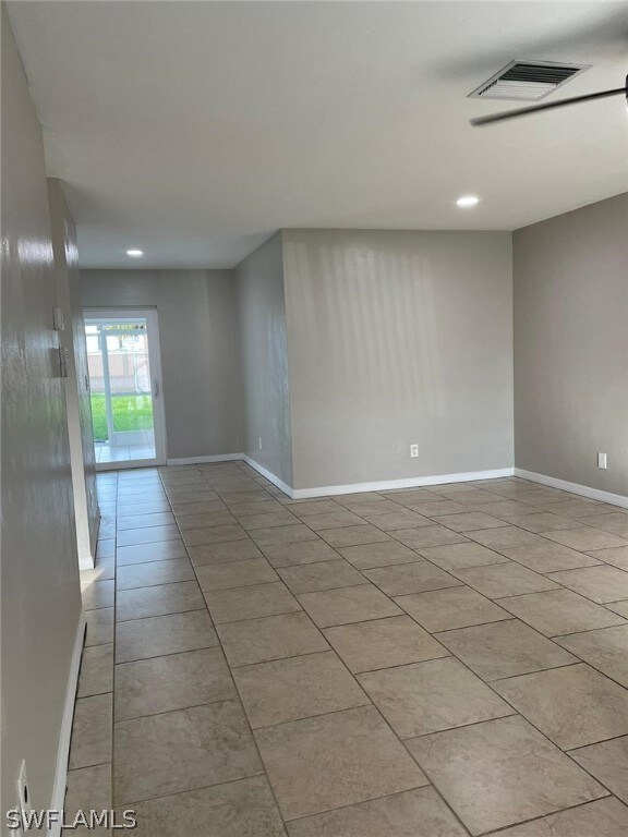 Living room featuring light tile floors