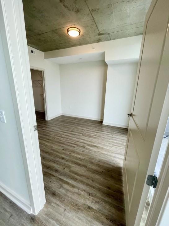 Unfurnished room featuring wood-type flooring