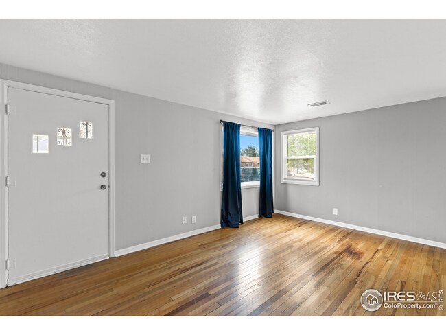 Living room with original hardwood floors.