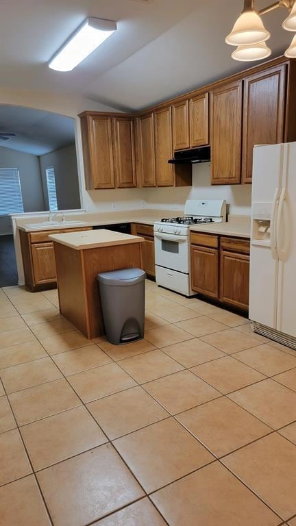 Kitchen with light countertops, light tile patter