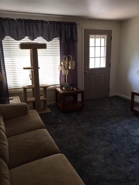 Newer front door, paint and vinyl windows.