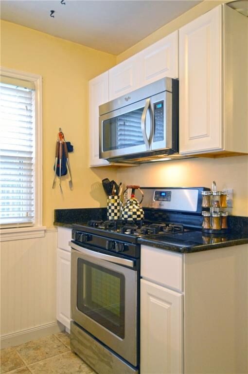Kitchen has stainless steel appliances and ceramic