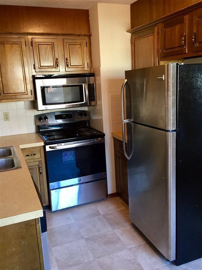 Kitchen with new flooring and brand new stainless 
