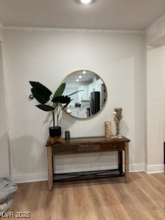 Details featuring ornamental molding, baseboards,