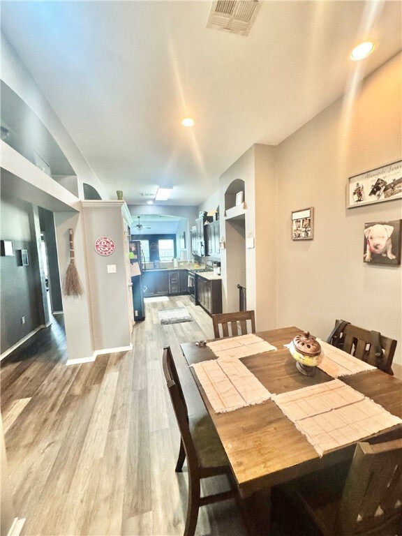 Dining area with light wood finished floors and re