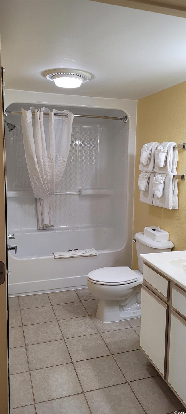 Full bathroom featuring tile patterned flooring,  