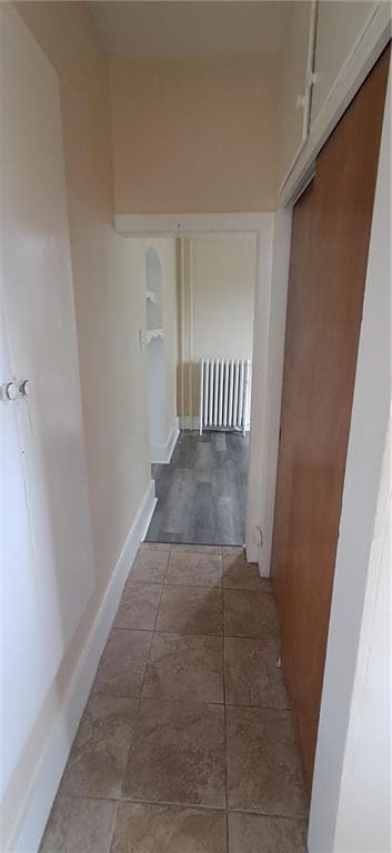 Hallway with pantry closet on the left