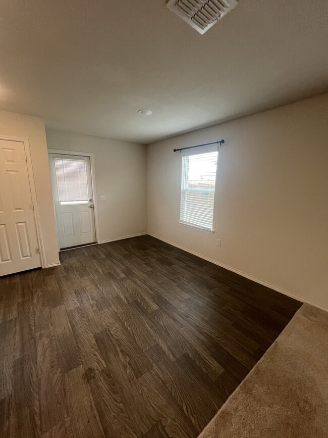 Unfurnished room with dark wood finished floors