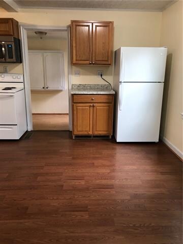 View of dining area and kitchen.  Through the door