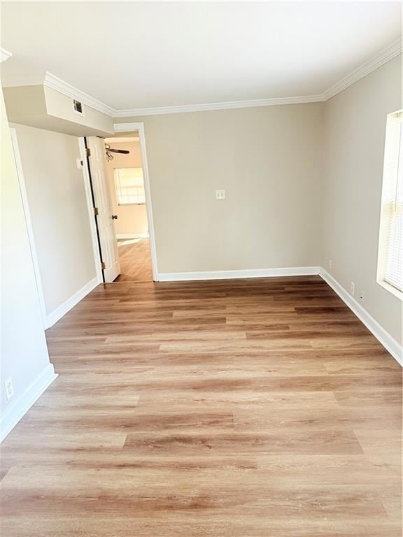 Empty room featuring light wood-style floors, base
