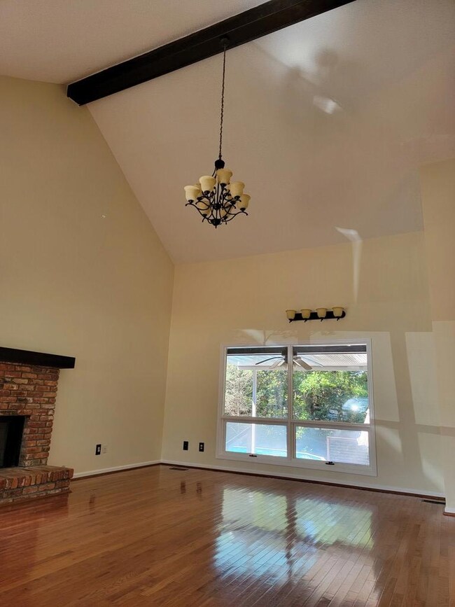 Wood floors and soaring ceilings