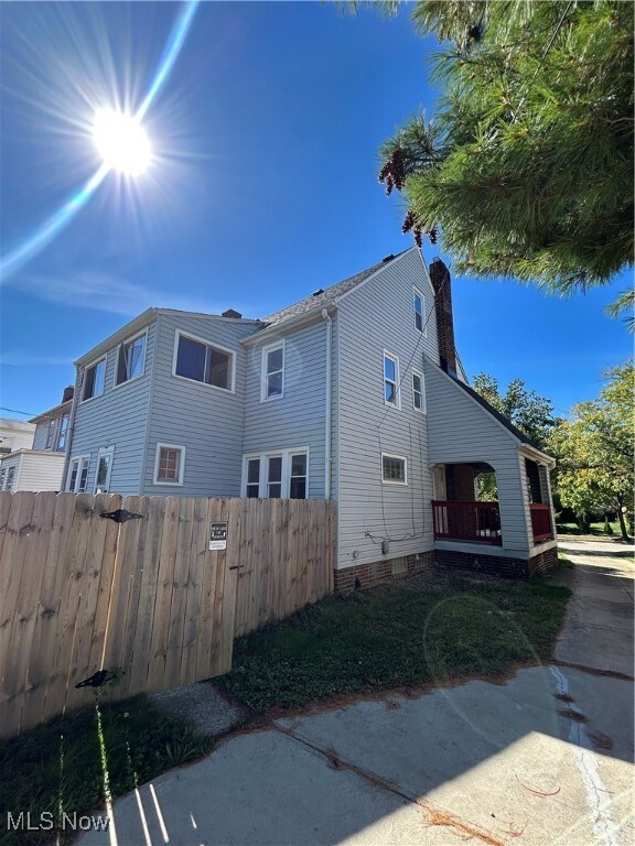 View of side of home with a chimney